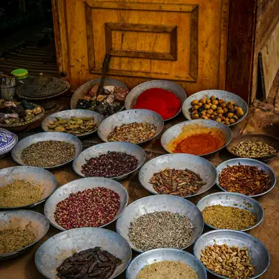 Bowls of whole and ground spices at a market