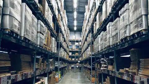 Tall warehouse racks stacked with pallets of goods